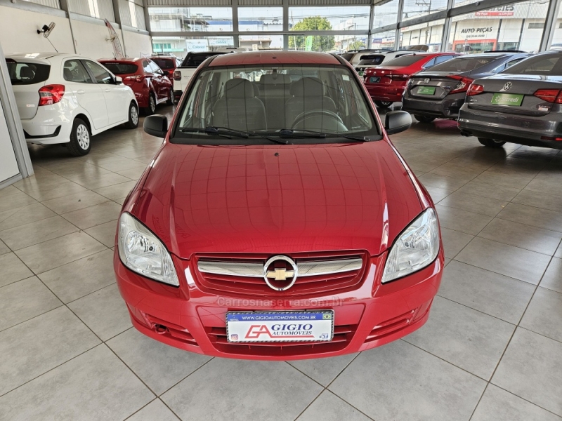 CHEVROLET - PRISMA - 2010/2011 - Vermelha - R$ 27.500,00